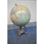 A 12 INCH TERESTRIAL GLOBE, made by Weber Costello Co of Chicago heights Illinois, on a cast base,