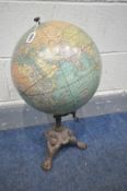 A 12 INCH TERESTRIAL GLOBE, made by Weber Costello Co of Chicago heights Illinois, on a cast base,