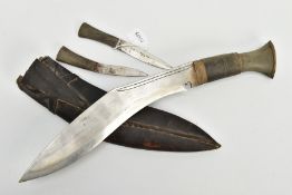 INDIAN SUB CONTINENT KUKRI KNIFE, in original scabbard, together with the two smaller knives