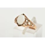 A 9CT GOLD OPAL DRESS RING, set with a central oval cut opal cabochon, six claw set, openwork