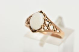 A 9CT GOLD OPAL DRESS RING, set with a central oval cut opal cabochon, six claw set, openwork