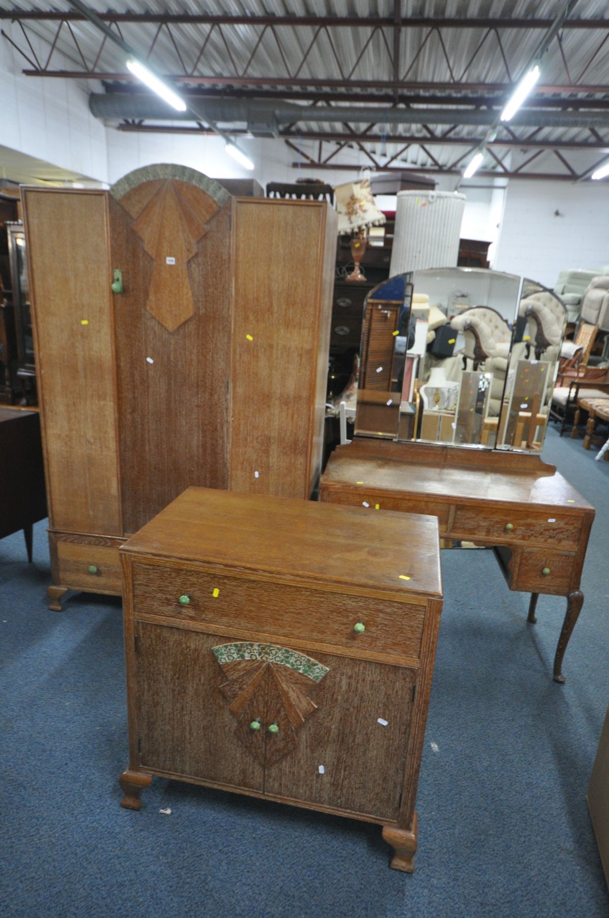 AN ART DECO LIMED OAK BEDROOM SUITE, comprising a single door wardrobe, with a single drawer,
