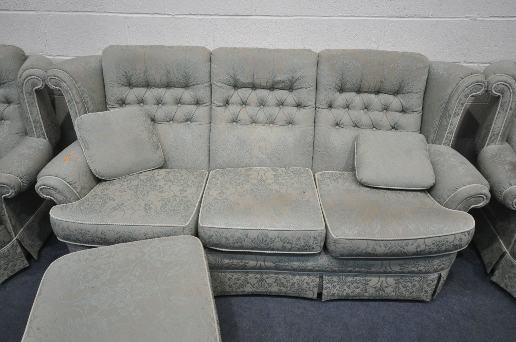 A FLORAL GREEN UPHOLSTERED LOUNGE SUITE, comprising a three seater sofa, pair of armchairs and a - Image 2 of 3