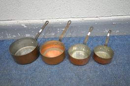 A SET OF FOUR COPPER GRADUATED PANS