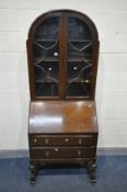 AN ART DECO OAK BUREAU BOOKCASE, with double astragal glazed door, the fall front with a fitted