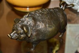 A 19TH CENTURY STYLE NOVELTY BRONZE TABLE BELL IN THE FRORM OF A PIG, fitted with a clockwork