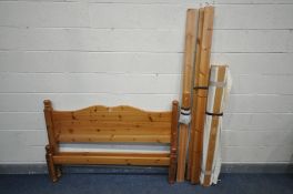 A MODERN PINE 4FT6 BEDSTEAD, with side rails, slat support, slats and bolt fixings