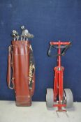 A VINTAGE GOLF BAG containing 10 Ben Hogan irons and two putters along with an Ace trolley