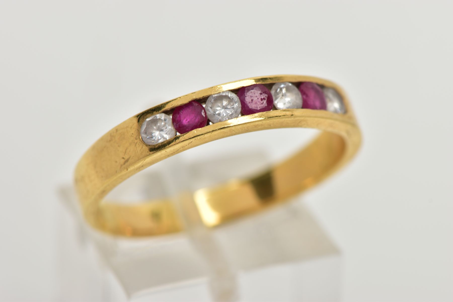 A RUBY AND DIAMOND HALF HOOP RING, yellow metal band, designed with a row of three channel set - Image 4 of 4
