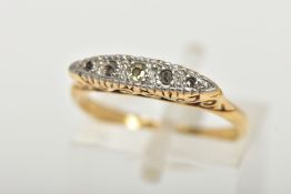 A YELLOW METAL FIVE STONE DIAMOND BOAT RING, the ring head of a lozenge shape set with single cut