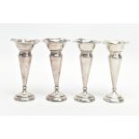 A COLLECTION OF FOUR SILVER POSEY VASES, silver fluted vase with wavey rims, weighted circular