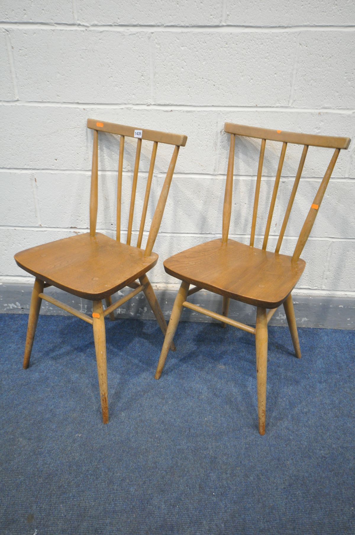 A PAIR OF ERCOL ELM MODEL 391 ALL PURPOSE CHAIRS (condition:-surface wear)