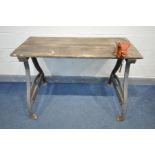 A VINTAGE BESPOKE TRESTLE WORK BENCH, with a slatted pine top, on a cast iron base, attached with