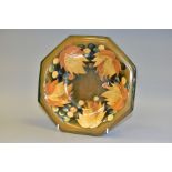 A MOORCROFT LEAVES AND BERRIES OCTAGONAL SALT GLAZE BOWL, stamped to underside of base, 25.5cm