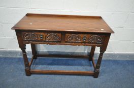 AN OLD CHARM OAK HALL TABLE, with two carved frieze drawers, on turned legs, united by stretchers,