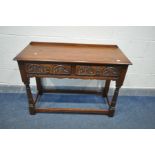 AN OLD CHARM OAK HALL TABLE, with two carved frieze drawers, on turned legs, united by stretchers,