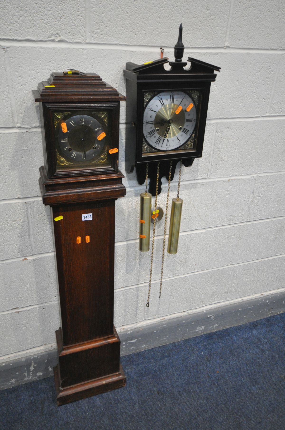 A 20TH CENTURY OAK GRANDDAUGHTER CLOCK, with an Ansonia clock co of USA movement, height 122cm, (