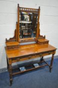 AN EDWARDIAN WALNUT DRESSING TABLE, with a single mirror and an arrangement with four drawers,