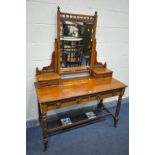 AN EDWARDIAN WALNUT DRESSING TABLE, with a single mirror and an arrangement with four drawers,