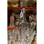 A WHITEFRIARS CRYSTAL DECANTER AND SHERRY GLASSES, comprising a mallet shaped decanter and