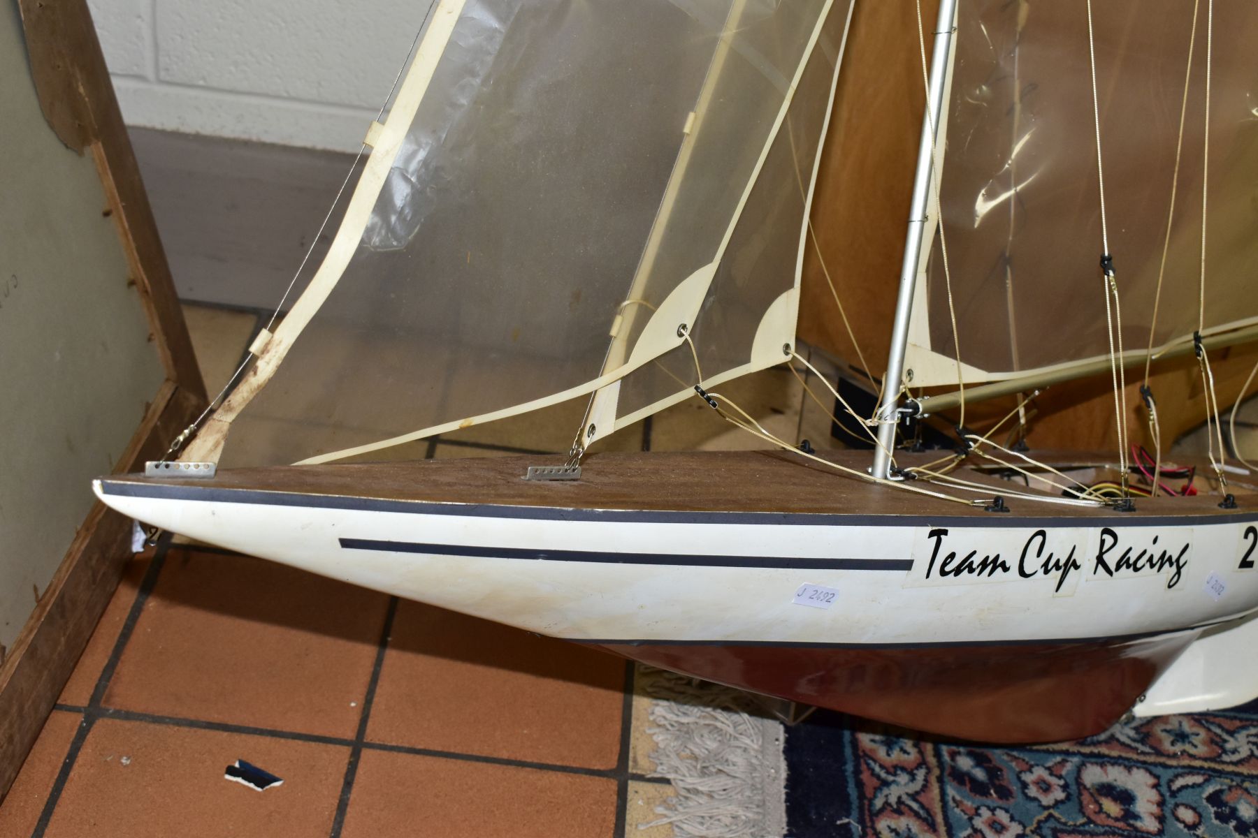 A SCRATCH BUILT MODEL YACHT, at full sail, the deck with rigging and clear sails, motor in hull, - Image 8 of 8