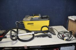 A KARCHER COMMERCIAL PUZZI 100 CARPET CLEANER with lance and two heads (PAT pass and working but