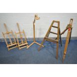 A VARIETY OF ARTIST EASELS, to include a pair of surface top easels, a Posi lock stand (losses) a