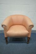 AN EARLY 20TH CENTURY MAHOGANY TUB CHAIR, with pink upholstery, ceramic casters, width 77cm x