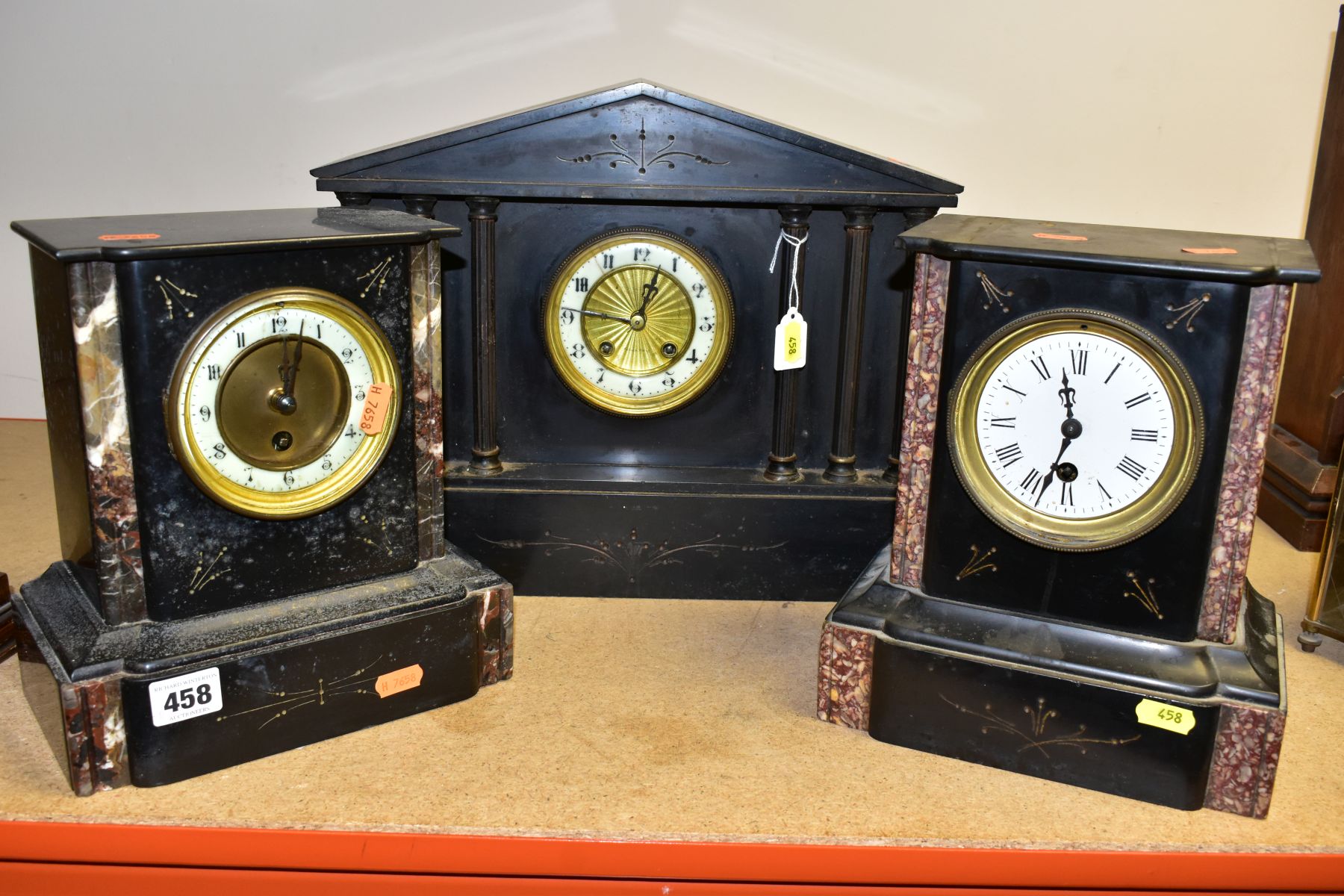 THREE LATE VICTORIAN BLACK SLATE AND MARBLE MANTEL CLOCKS, two of rectangular form with thirty