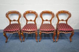 A SET OF FOUR OAK DINING CHAIRS (condition:-one chairs seat pad damaged)