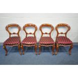 A SET OF FOUR OAK DINING CHAIRS (condition:-one chairs seat pad damaged)