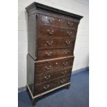 A GEORGIAN MAHOGANY CHEST ON CHEST, of two short and six long drawers, with a central brushing