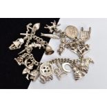 A WHITE METAL CHARM BRACELET, curb link bracelet fitted with twenty-four charms in forms such as a