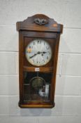 AN EARLY TO MID 20TH CENTURY OAK WALL CLOCK, height 78cm (winding key and pendulum) (good