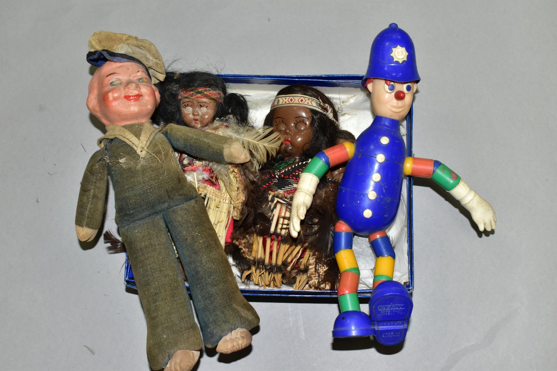 VINTAGE COLLECTORS DOLLS, comprising a Maori? woman with child, tiki pendant around her neck,