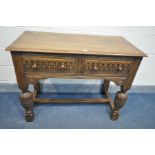 A MID CENTURY REPRODUCTION SOLID OAK SIDE TABLE, with two frieze drawers, chip-carved apron, on
