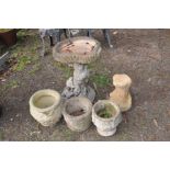 A COMPOSITE BIRDBATH IN THE STYLE OF A TREE TRUNK, height 61cm together with a tree trunk base (