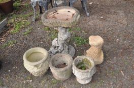 A COMPOSITE BIRDBATH IN THE STYLE OF A TREE TRUNK, height 61cm together with a tree trunk base (