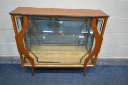 A MID CENTURY TEAK CHINA CABINET, with two decorated sliding doors, enclosing two glass shelves,