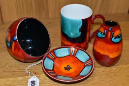 FOUR PIECES OF POOLE POTTERY, in Volcano pattern, comprising a mug, a small oval vase height 11cm, a