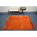 A MODERN ORANGE RECTANULAR SHAGGY RUG, length 170cm x 120cm, a rectangular marble top coffee table