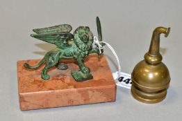 A 20TH CENTURY CAST IRON VERDIGRIS PAINTED WINGED LION PAPERWEIGHT, mounted on a rectangular