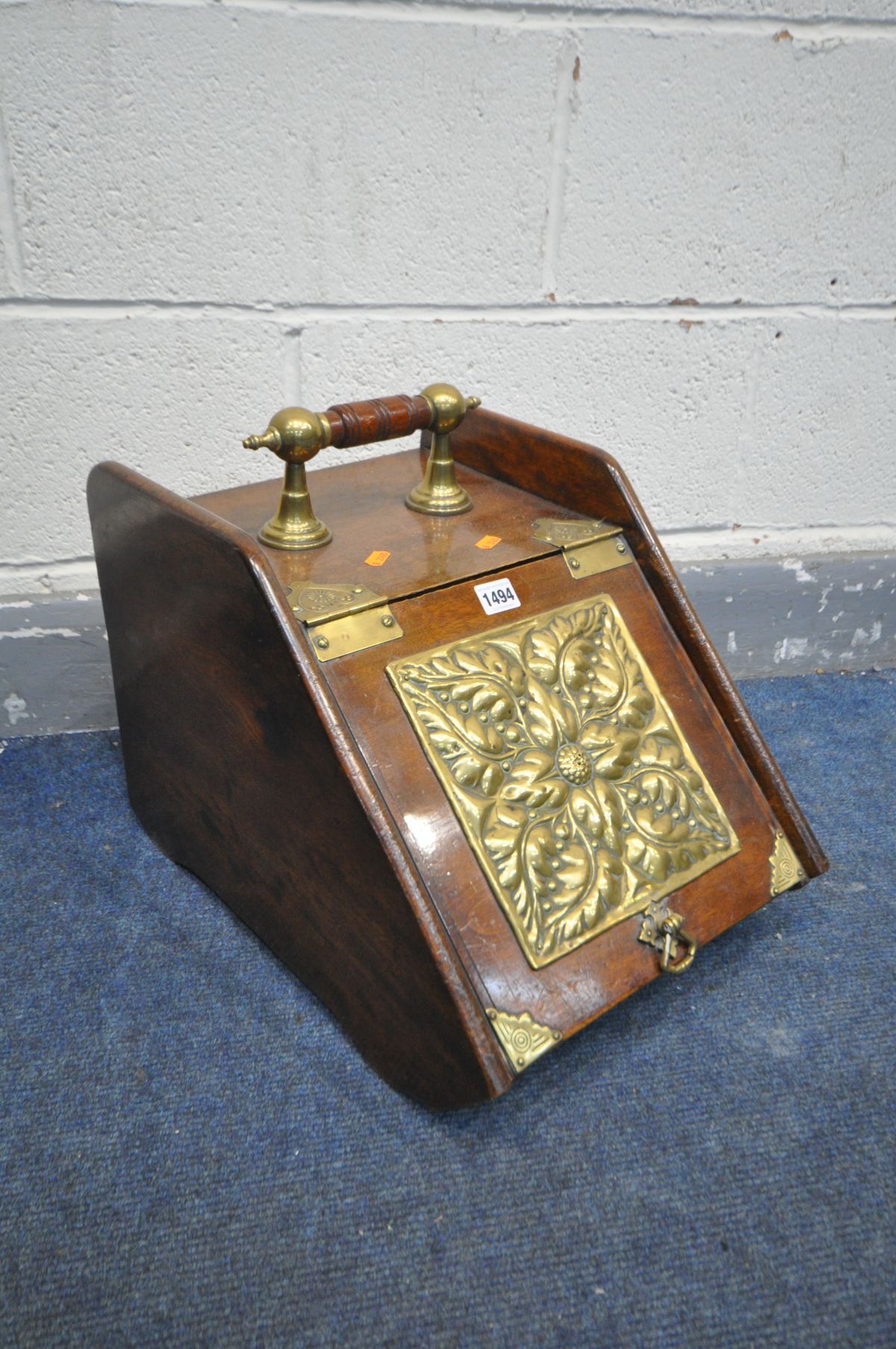 AN EDWARDIAN MAHOGANY PURDONIUM with an embossed brass panel