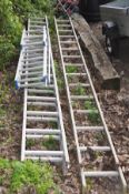 A SET OF ALUMINIUM 4M DOUBLE EXTENSION LADDERS together with a single 4M set of ladders and three