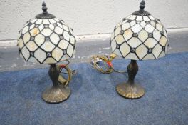 A PAIR OF TIFFANY STYLE TABLE LAMPS and a french style gilt wall mirror (3)