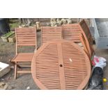 A TEAK SLATTED CIRCULAR GARDEN TABLE, diameter 108cm together with four matching chairs and a non-