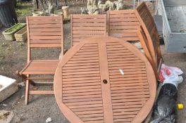 A TEAK SLATTED CIRCULAR GARDEN TABLE, diameter 108cm together with four matching chairs and a non-