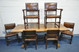 A MID CENTURY REPRODUCTION SOLID OAK REFECTORY TABLE, on trestle legs united by a stretcher,