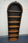 A REPRODUCTION OAK TALL WATERFALL BOOKCASE, with seven shelves, width 54cm x depth 25cm x height