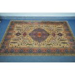 A 'WOODWARD GROSVENOR' PERSIAN RECTANGULAR WOOLLEN RUG, of foliate design, beige ground with a